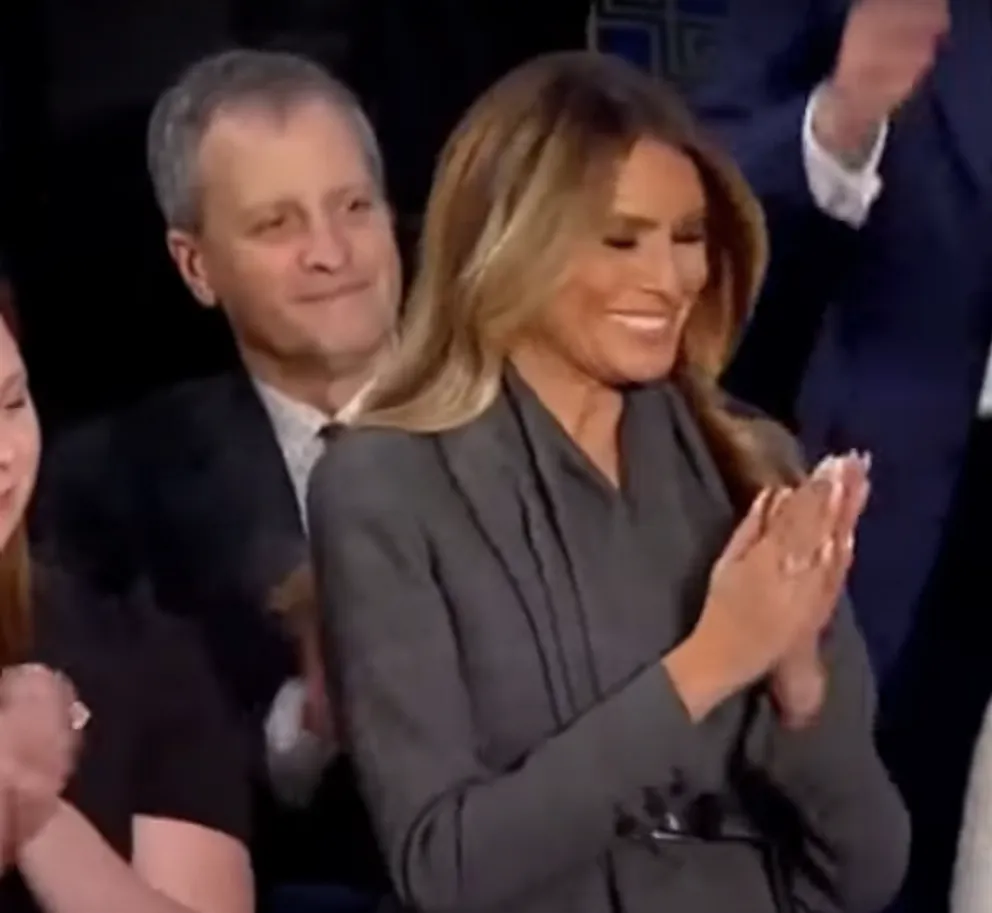 Melania Trump smiling and clapping along with the audience. | Source: YouTube/Forbes Breaking News